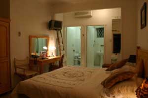 Comfort double or twin with garden view, king bed, private facilities (bath and shower), and breakfast